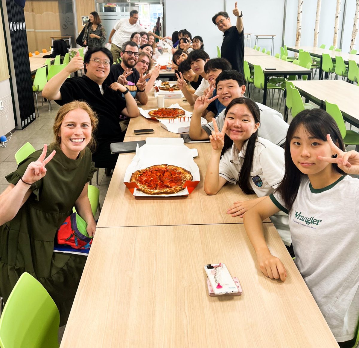 Korean and American students share a meal together in the cafeteria