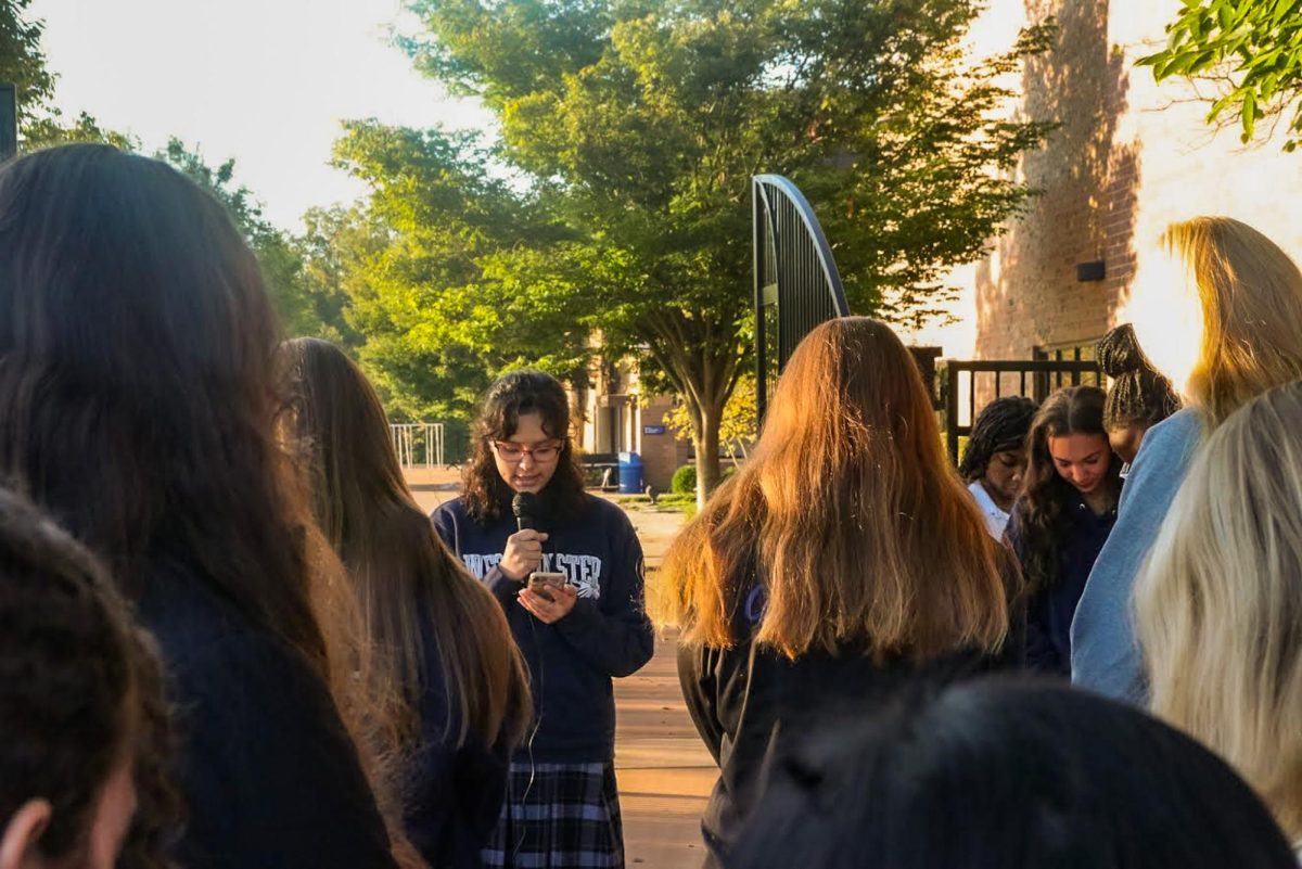 Students gather and listen to sermon from a student speaker.