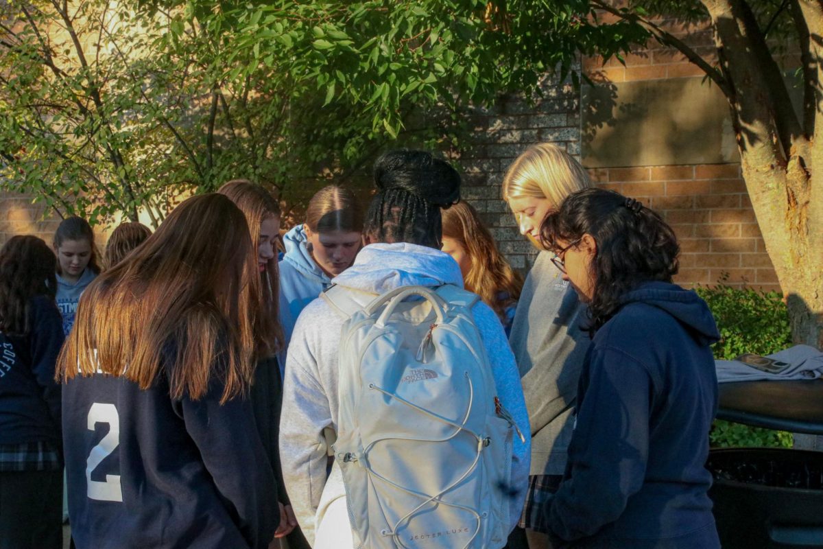 Junior and Seniors huddle in deep prayer on various issues effecting our nation. 