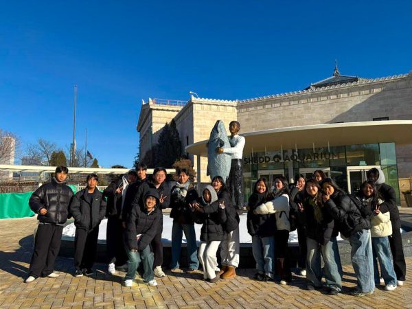 The Korean Exchange Students Take a Picture at The Shedd Aquarium in Chicago