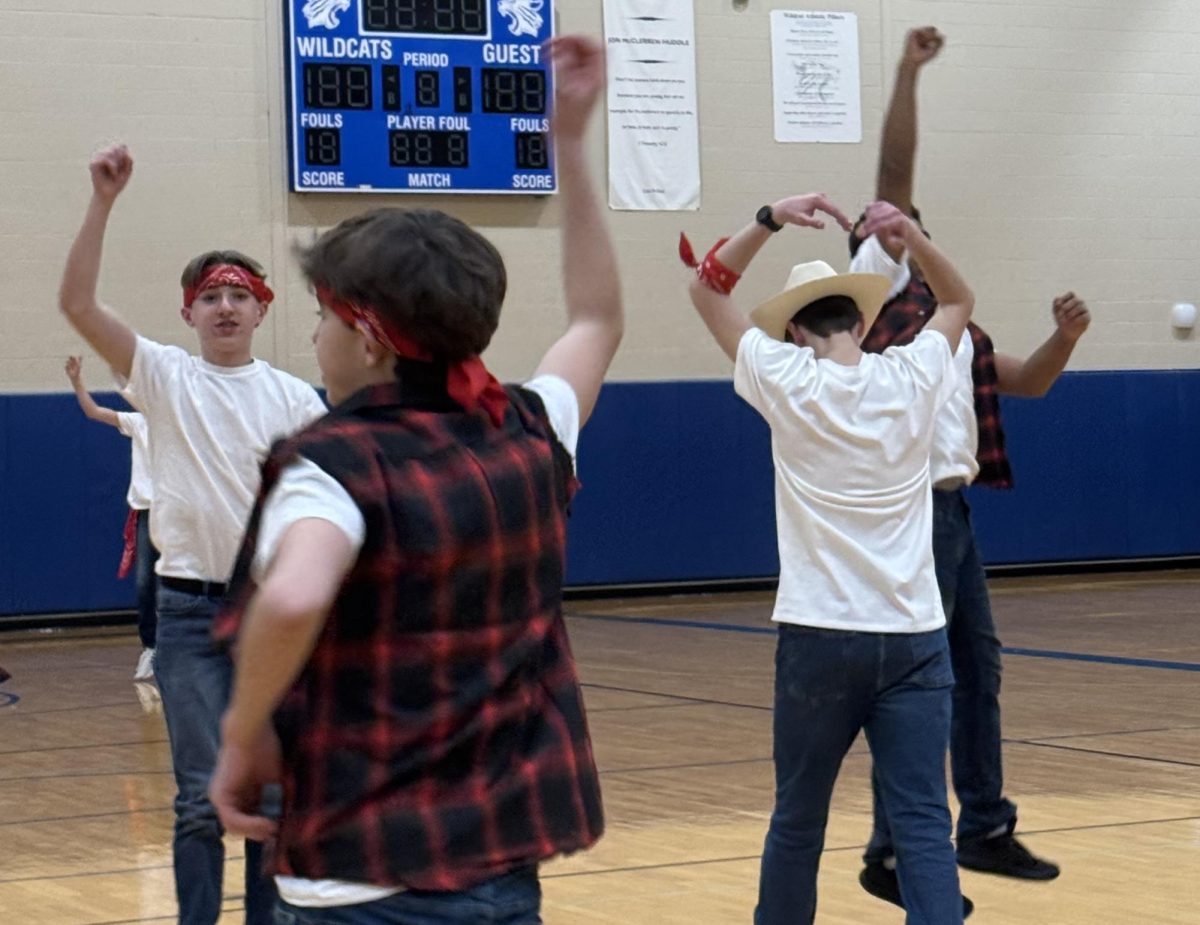 Ninth Grade Boys Poms Practices for Their Community Night Performance