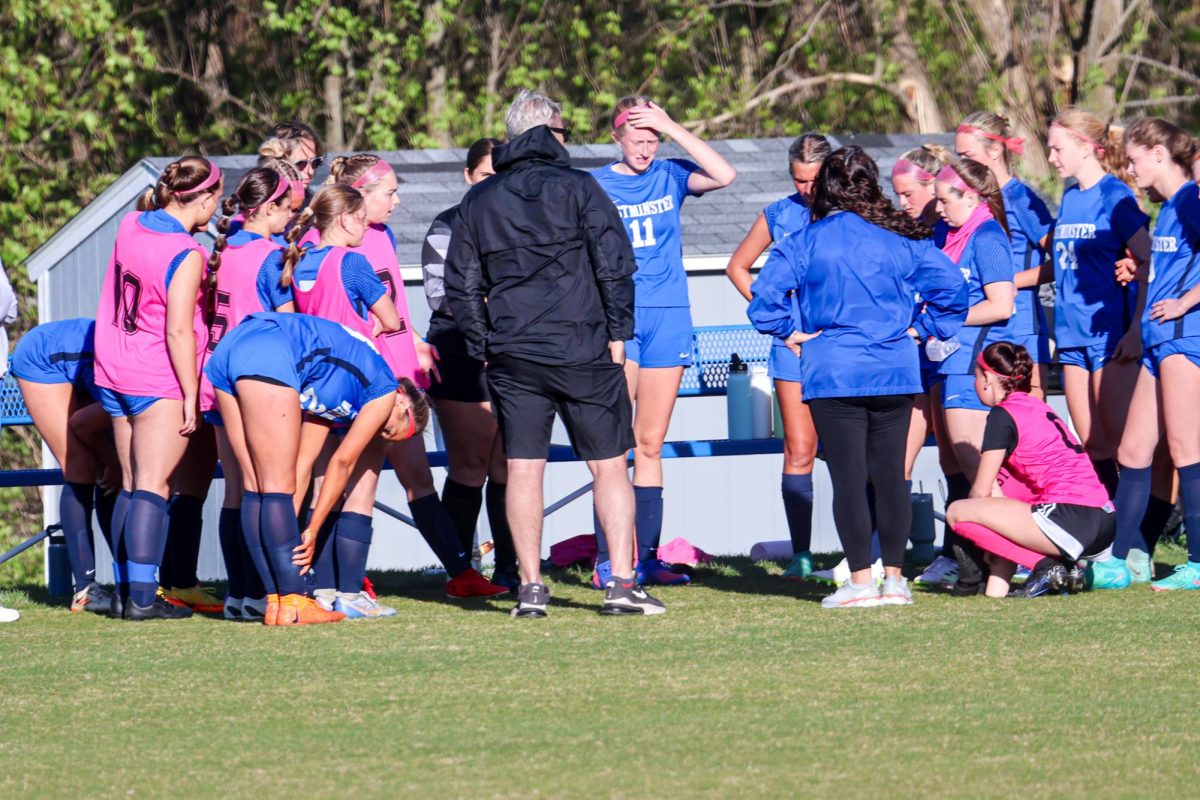 Girl's soccer team huddles pregame